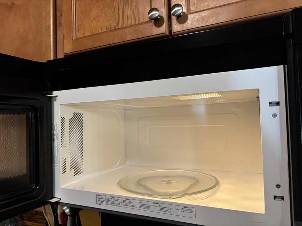 A sparkling clean microwave interior, showcasing the deep cleaning services of Natural Clean in Sioux Falls, SD.