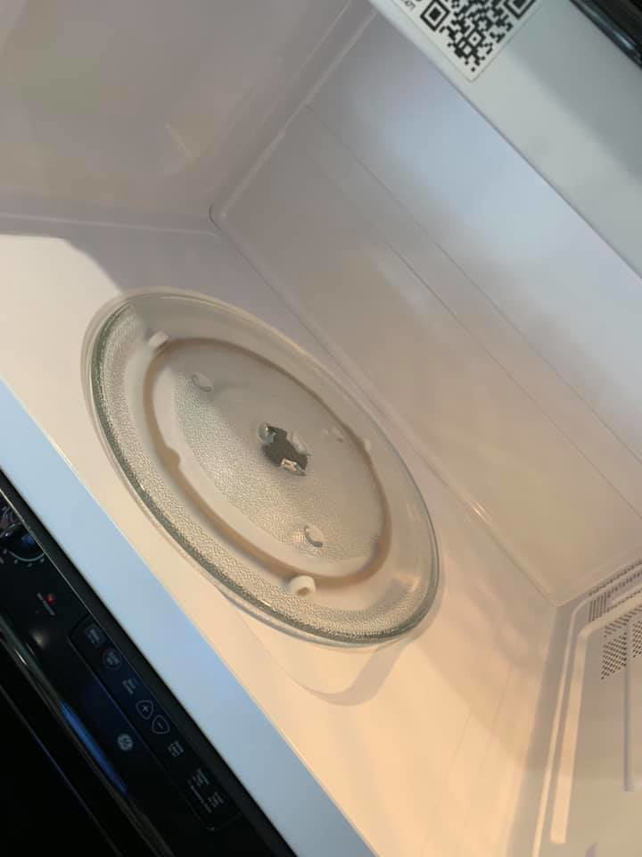 The sparkling clean interior of a microwave oven, demonstrating the detailed cleaning services of Remy the Cleaner in Indianapolis, IN.
