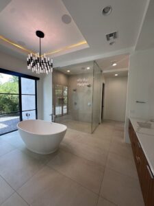 A sparkling clean modern bathroom with a freestanding tub and glass shower, cleaned by Cleaners of Arizona in Chandler, AZ.