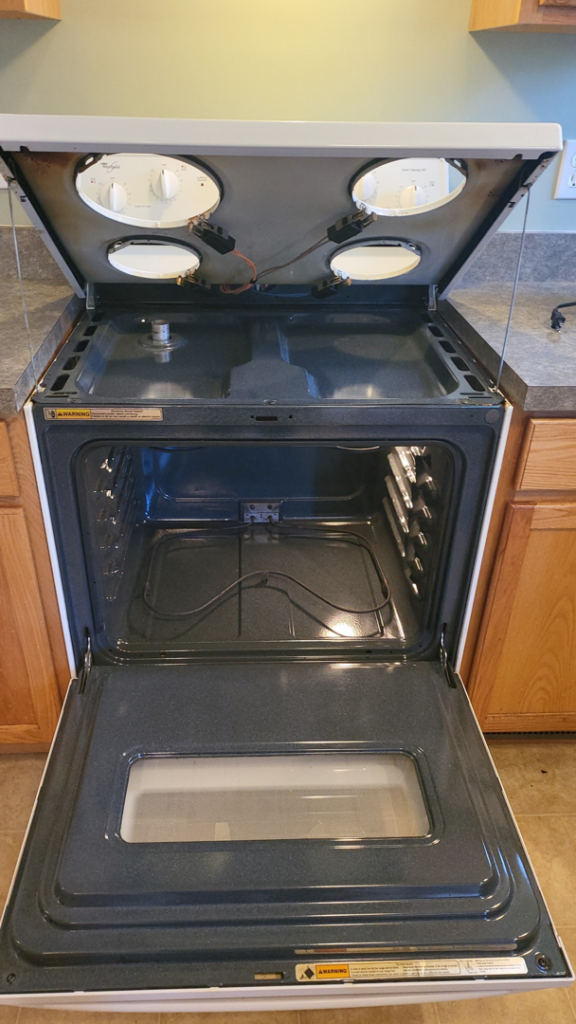 A sparkling clean oven and stovetop after professional cleaning by Blossom Cleaning & Organizing LLC, South Bend, IN.