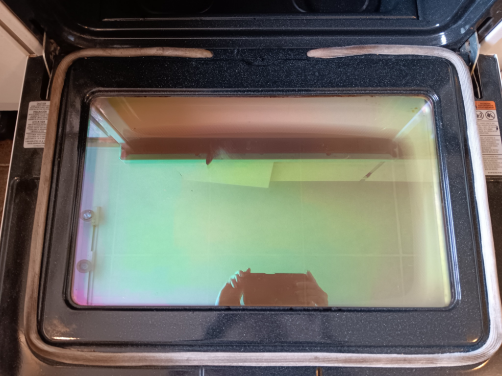 A sparkling clean oven door window, showcasing professional deep cleaning services by Clean Montana, LLC in Missoula, MT.