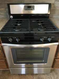 A sparkling clean stainless steel gas oven and range, professionally cleaned by Pristine Cleaning Concepts in Stillwater, OK.