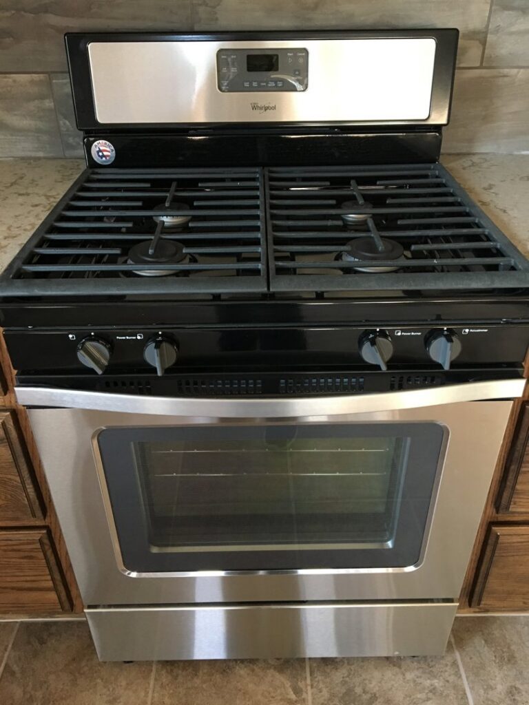 A sparkling clean stainless steel gas oven and range, professionally cleaned by Pristine Cleaning Concepts in Stillwater, OK.