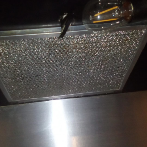 A sparkling clean range hood filter, demonstrating the thorough cleaning services of Anna's cleaning house in Sun Valley, CA.