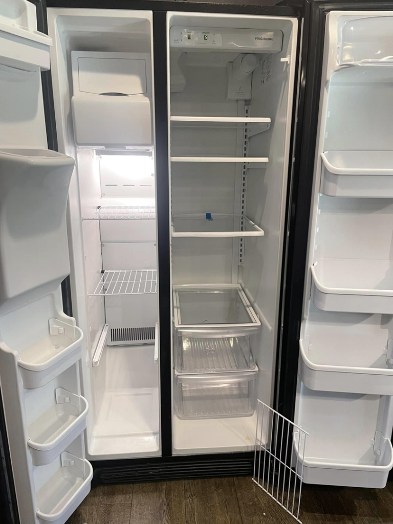 A sparkling clean and empty refrigerator interior after professional cleaning by VM Residential cleaning LLC in Baton Rouge, LA.