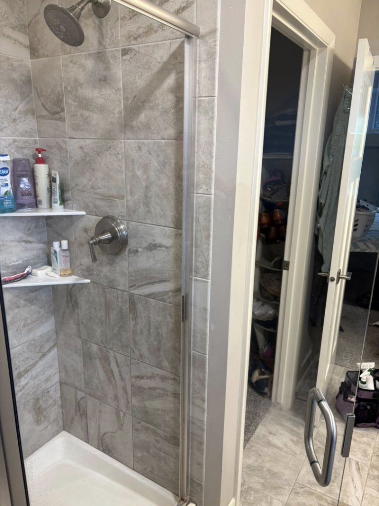 A sparkling clean shower after professional cleaning by Warm & Cozy House Cleaning in Madison, WI