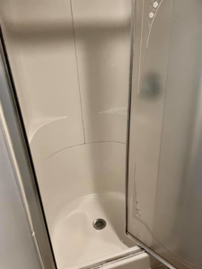A sparkling clean shower stall with clear glass doors, showcasing the quality work of Every Time Cleaning in Cedar Rapids, IA.