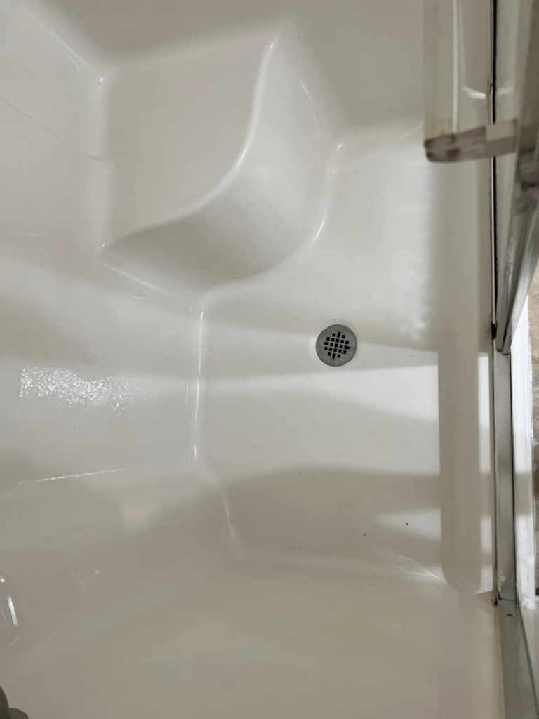 A sparkling clean shower stall, showcasing the meticulous cleaning services by Stay at Home Maids in Roanoke, VA.