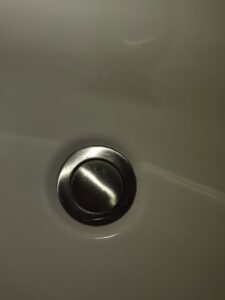 A sparkling clean metal sink drain, showcasing the detailed cleaning provided by Maid to Serve HIM in Cincinnati, OH.