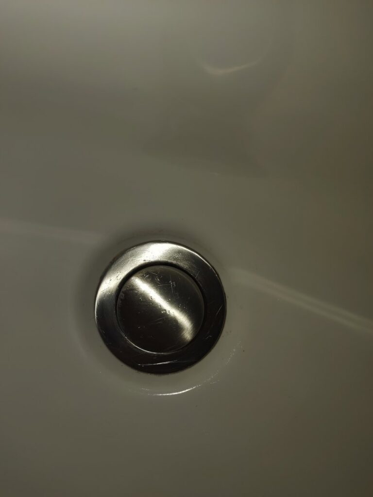 A sparkling clean metal sink drain, showcasing the detailed cleaning provided by Maid to Serve HIM in Cincinnati, OH.
