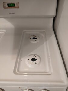 A sparkling clean stovetop, showcasing the excellent results of Chelle's Cleaning Services in Gary, IN.