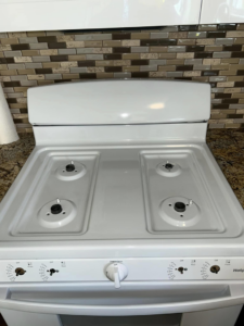A sparkling clean white stovetop after professional cleaning by Superior Quality Cleaners in Sacramento, CA