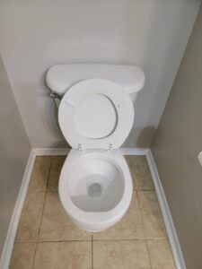 A sparkling clean toilet in a bathroom, demonstrating the meticulous cleaning services of AG Simply Clean in Concord, NC.