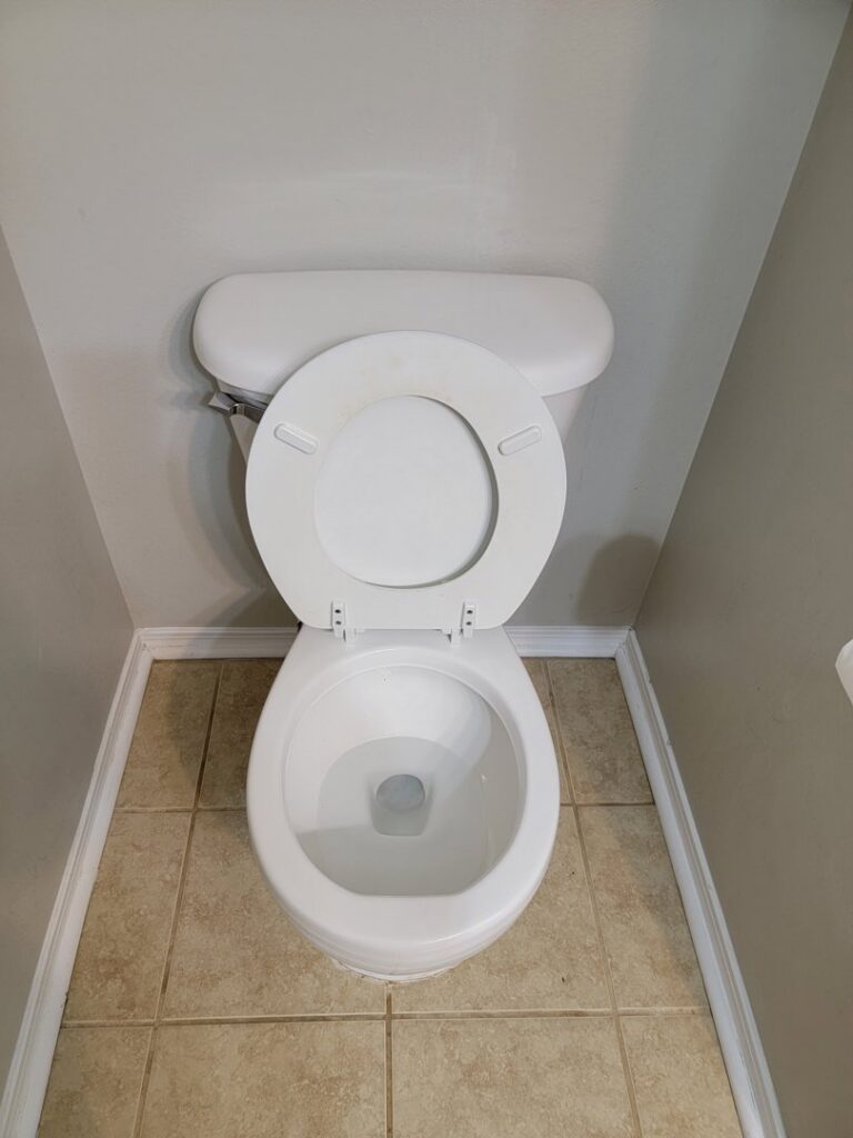 A sparkling clean toilet in a bathroom, demonstrating the meticulous cleaning services of AG Simply Clean in Concord, NC.