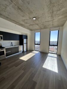 A spotless apartment kitchen and living area, professionally cleaned by Cleaners of Arizona in Chandler, AZ.