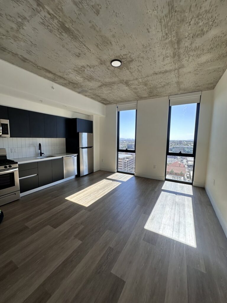A spotless apartment kitchen and living area, professionally cleaned by Cleaners of Arizona in Chandler, AZ.