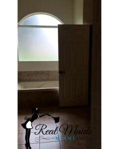 A spotless bathroom with a clean tub and tiled floor, cleaned by Real Maids of Miami, LLC in Miami, FL.