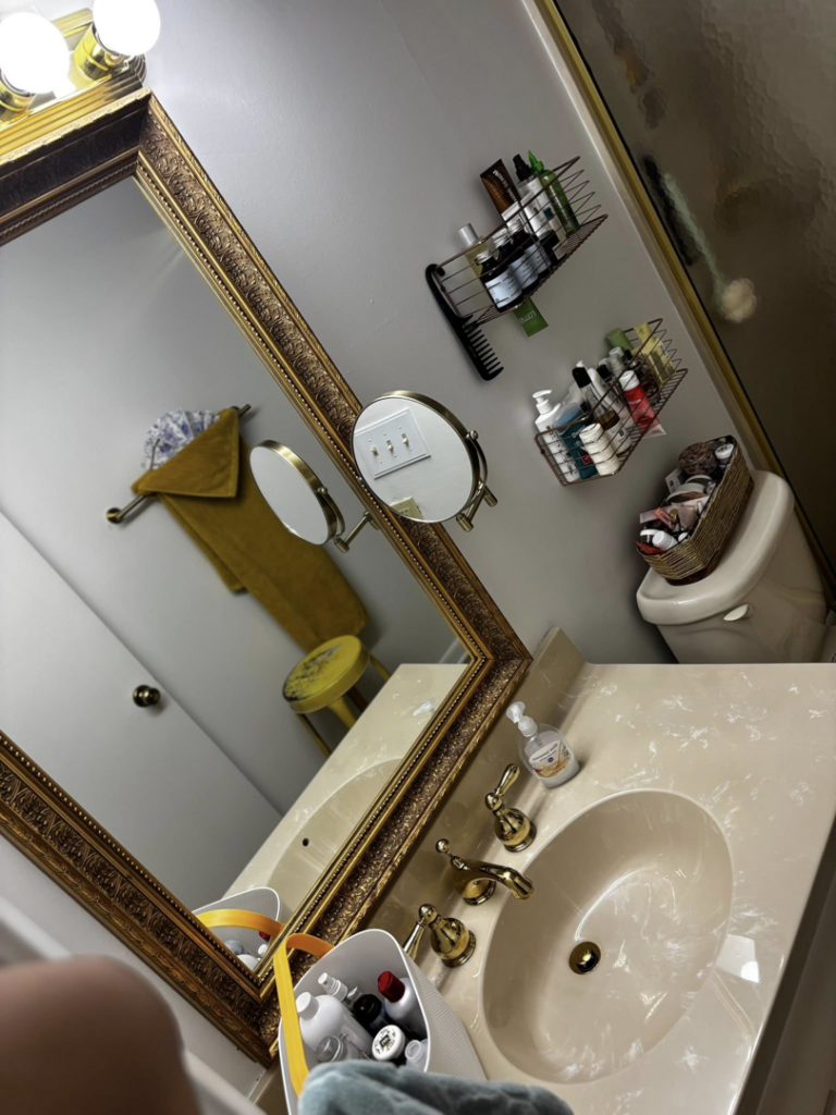 A spotless bathroom vanity with a clean sink and mirror, reflecting the thorough house cleaning services of BuzzSide Cleaning LLC in Little Rock, AR.