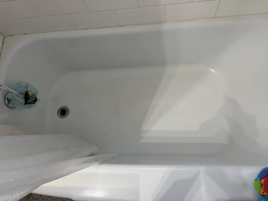 A spotless white bathtub, thoroughly cleaned and ready for use by Shine Bright Cleaning Co. in Overland Park, KS.