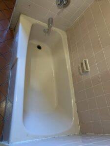 A spotless bathtub in a clean bathroom, showcasing professional cleaning by Maids & Multi Services by Landry, LLC in Bristol, CT.