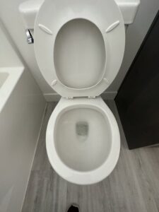 A spotless and clean toilet, demonstrating the thorough bathroom cleaning services provided by Groove-By-Nature Cleaning in Idaho Falls, ID.