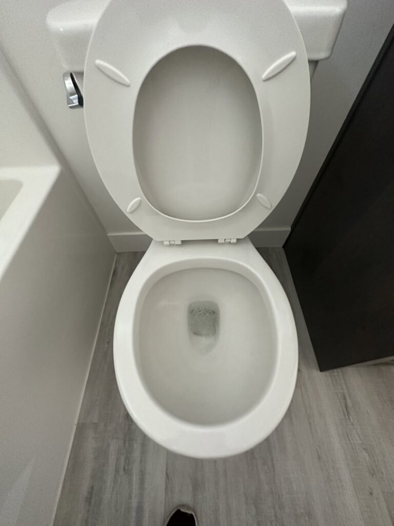 A spotless and clean toilet, demonstrating the thorough bathroom cleaning services provided by Groove-By-Nature Cleaning in Idaho Falls, ID.