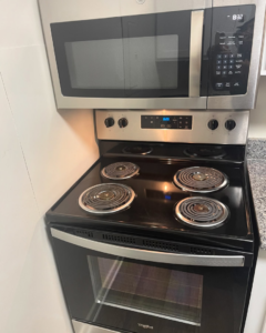 A spotless electric stove and microwave after professional cleaning by Per Your Request Richmond in Glen Allen, VA.