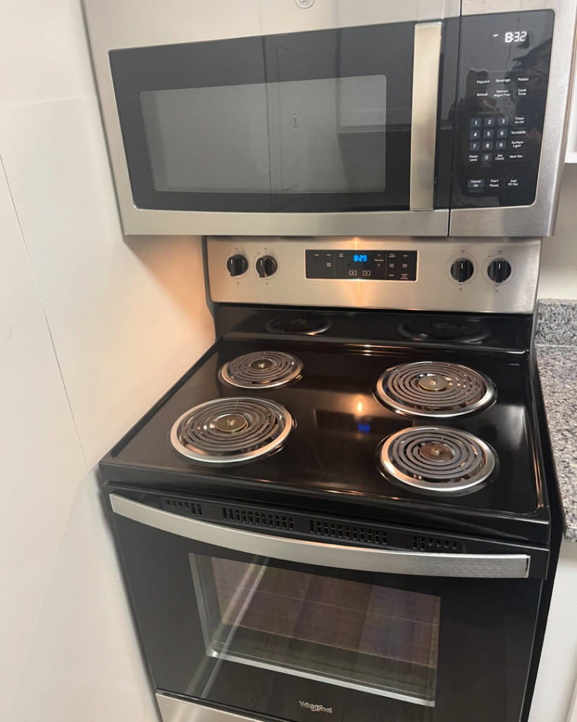 A spotless electric stove and microwave after professional cleaning by Per Your Request Richmond in Glen Allen, VA.
