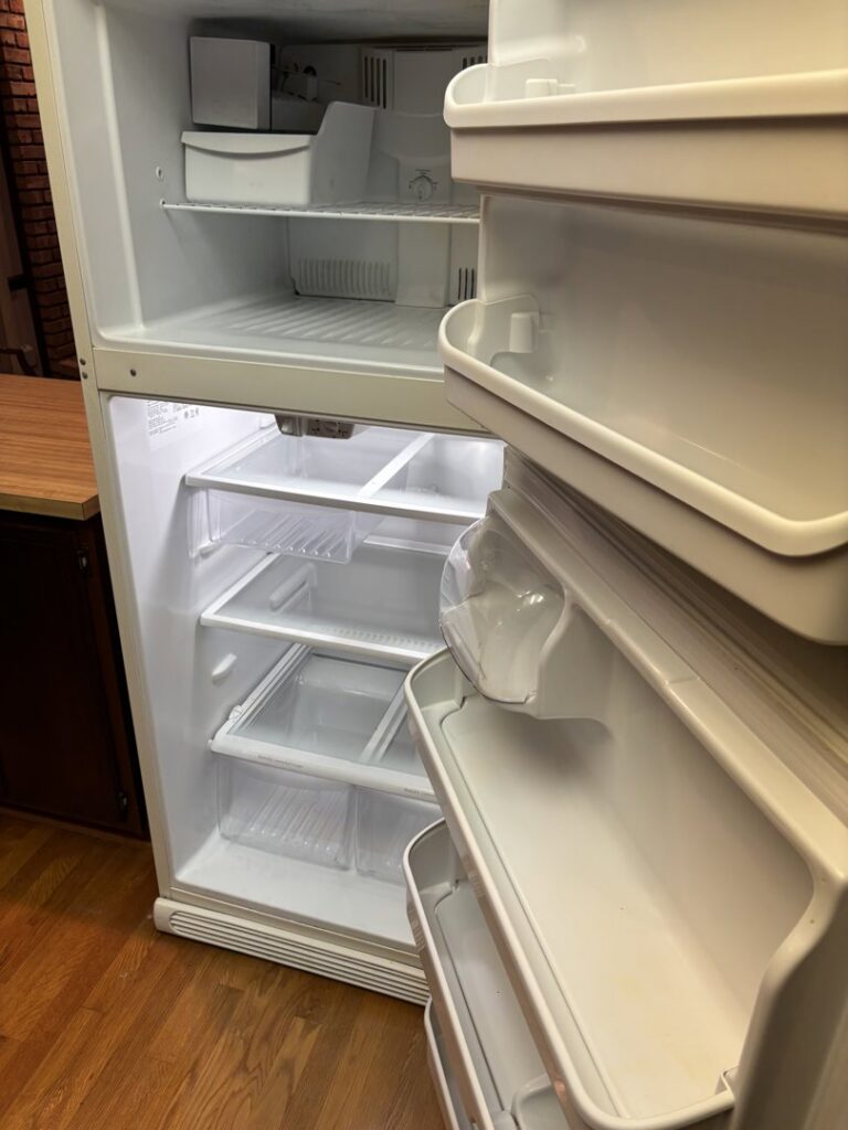 A spotless and thoroughly cleaned empty refrigerator interior, a service provided by Maid In Indy in Indianapolis, IN.