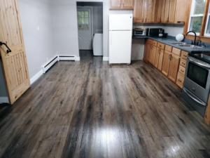 A spotless kitchen with clean wood-look laminate flooring by Sanchez Cleaning Service, LLC in San Antonio, TX.