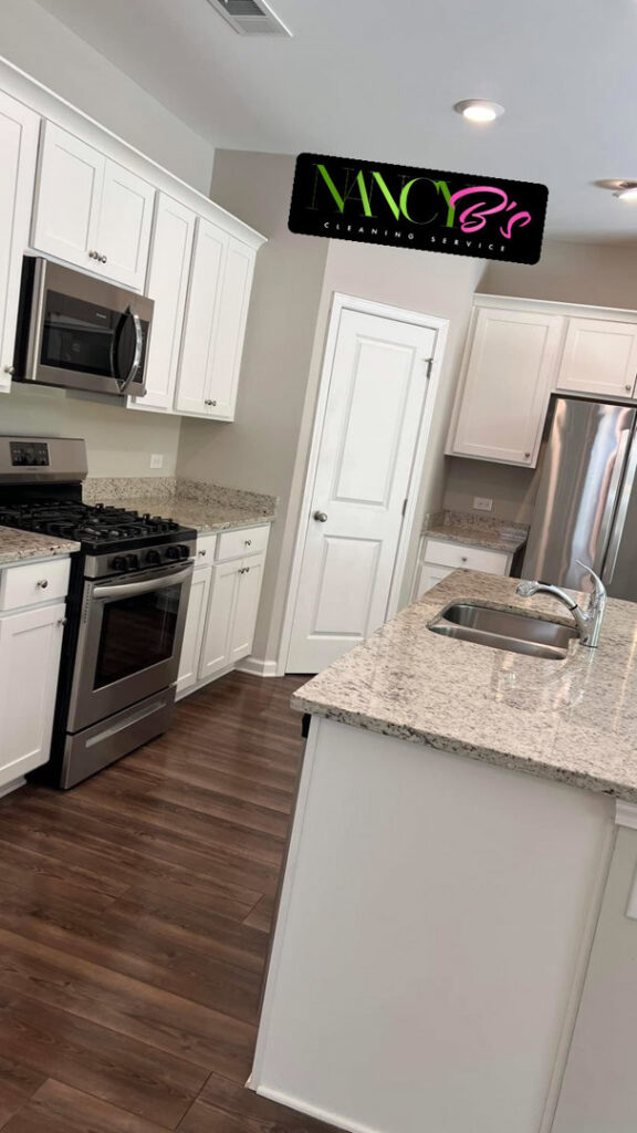 A spotless kitchen with white cabinets and granite countertops cleaned by Nancy B's Cleaning Service LLC in Atlanta, GA.