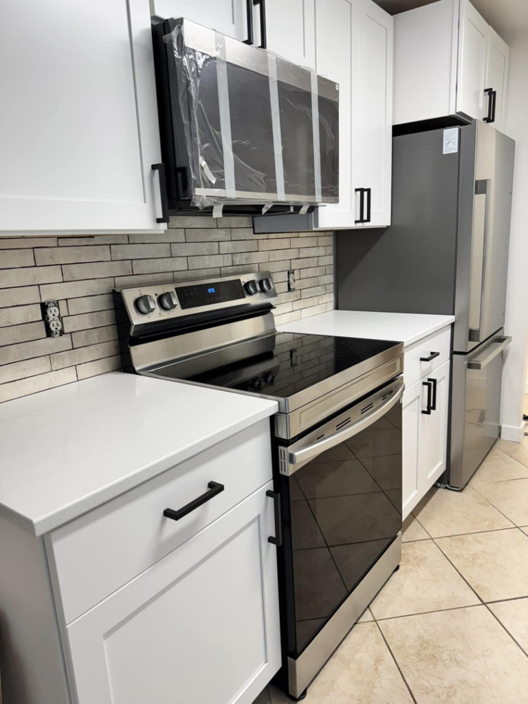 A spotless kitchen with new appliances, showcasing a move-in clean by Dust Detail Cleaning Services in Post Falls, ID.