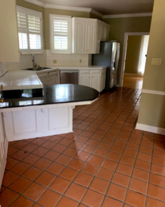 A spotless kitchen featuring white cabinets and clean tile flooring, cleaned by Keeks Kleaning LLC in Baton Rouge, LA