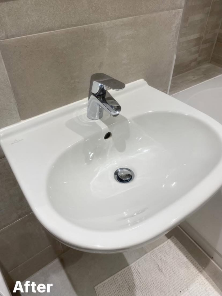 A spotless modern bathroom sink and faucet after professional cleaning by Nicy Cleaning Service in Danbury, CT.