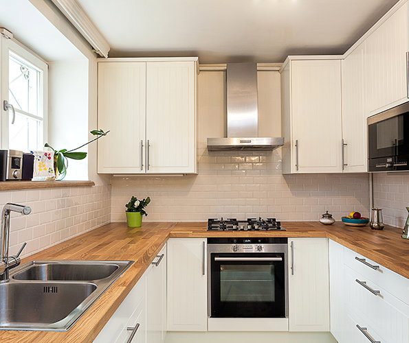 A spotless and organized modern kitchen, showcasing the results of house cleaning by Cleaning with Lisseth in Madison, WI.