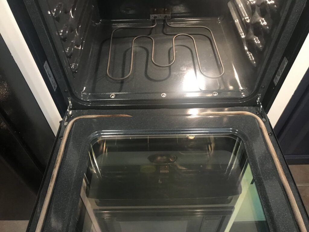 A spotless and thoroughly cleaned oven interior, highlighting the deep cleaning services provided by A Clean Xscape LLC in Chandler, AZ.