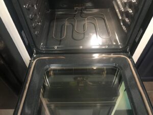 A spotless and thoroughly cleaned oven interior, highlighting the deep cleaning services provided by A Clean Xscape LLC in Chandler, AZ.