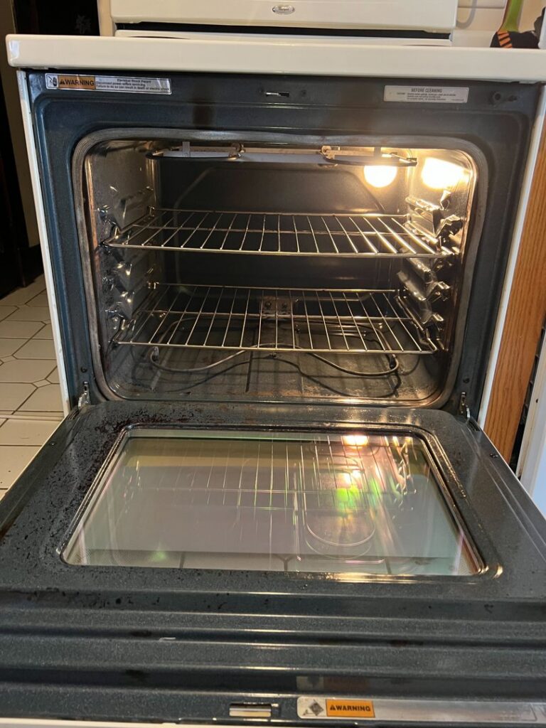 A spotless oven interior with clean racks, demonstrating the deep cleaning service by Jessie Clean in Indianapolis, IN.