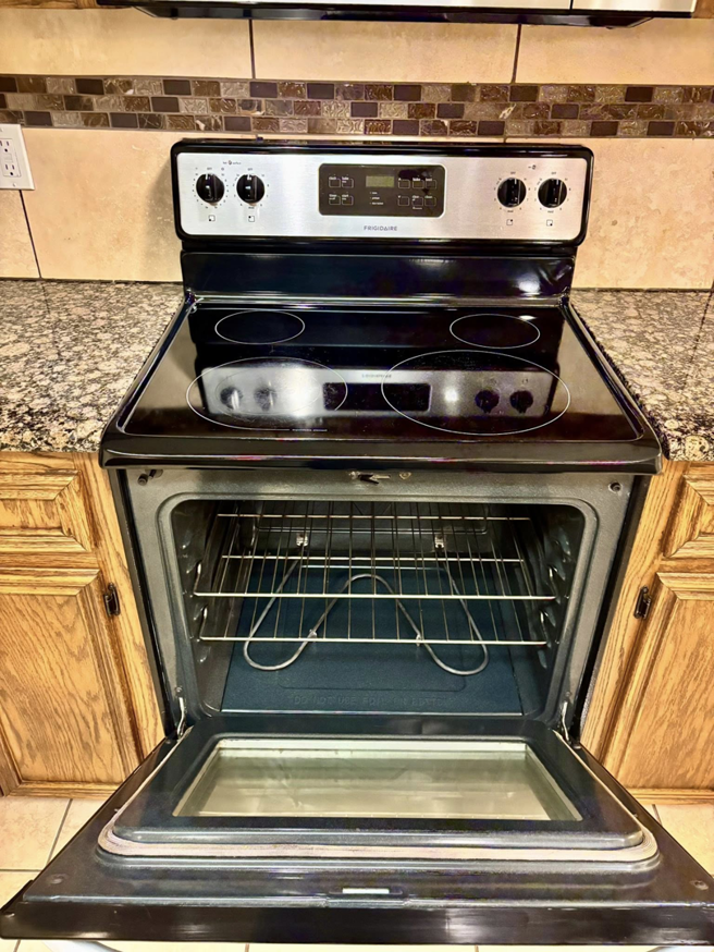 A spotless and thoroughly cleaned oven interior, showcasing deep cleaning services from Apryl's Cleaning Service in Corpus Christi, TX.