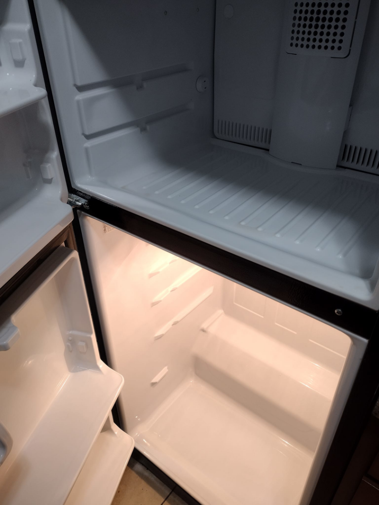 A spotless and thoroughly cleaned refrigerator interior after service from By Grace Cleaning Solutions, LLC in Cincinnati, OH.