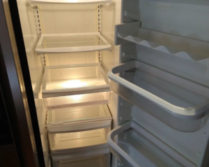 The spotless interior of a refrigerator with clean shelves and drawers, cleaned by Sunrise Cleaning in Saint Petersburg, FL.
