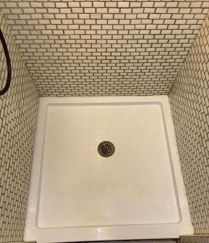 A spotless and thoroughly cleaned shower floor by Carissa's Green Cleaning LLC in Toledo, OH.