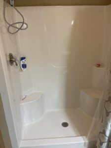 A spotless and well-maintained shower stall after professional cleaning by Wilkie Wonders Cleaning in Akron, OH.