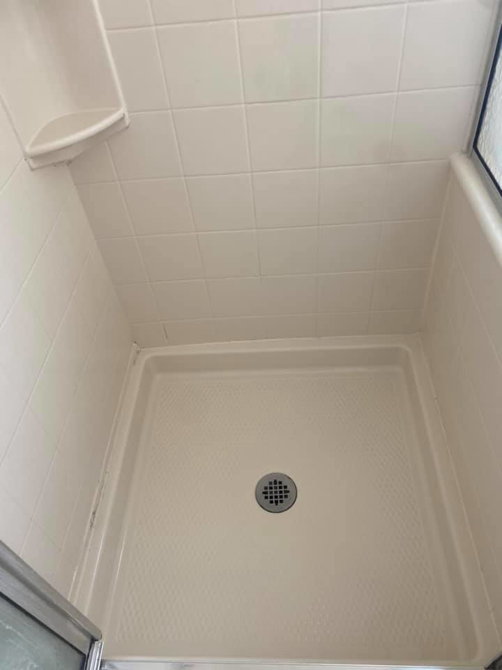A spotless and thoroughly cleaned shower stall, demonstrating the quality cleaning services of Jr services in Virginia Beach, VA.