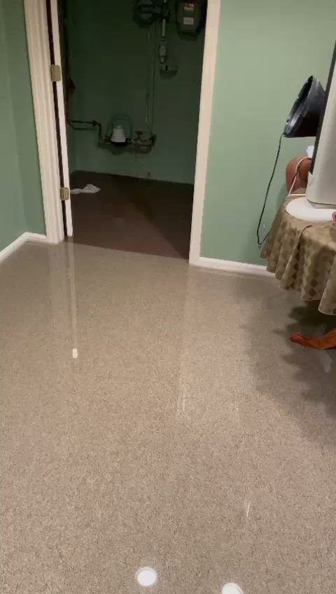 Standing water on a floor indicating a water damage incident, ready for cleanup by NSH Home Services in Jersey City, NJ.