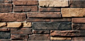 Close-up of a rustic stone veneer siding texture, a service offered by Eastern Stucco Restorations in Rock Hill, SC.