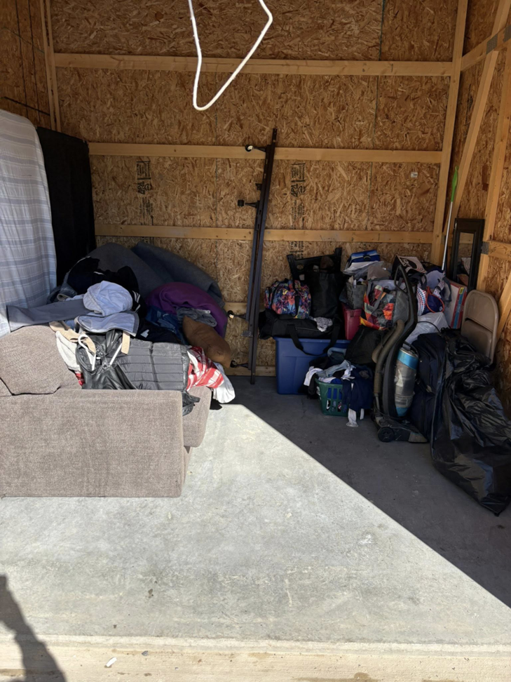 A storage unit packed with various household items, ready for moving or organization by Groovy Movers LLC in Batavia, NY.