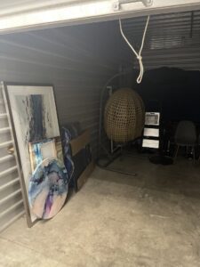 A storage unit filled with various household items, offered by Leaders Moving & Storage Co. in Indianapolis, IN.
