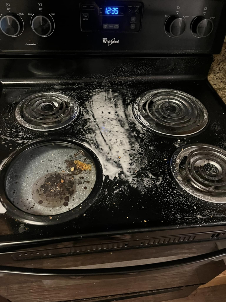 An electric stovetop with cleaning product applied, showing the cleaning process by You have it maid in Canton, MI.
