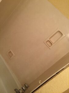 A stripped-down bathtub area with bare walls after old surround removal by Rayshawn's Home improvement & Construction work in Bossier City, LA.